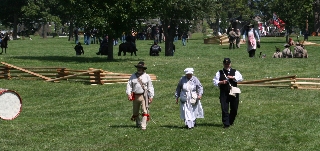 The Chaplain, the Scout and Nurse Jo on the field during battle